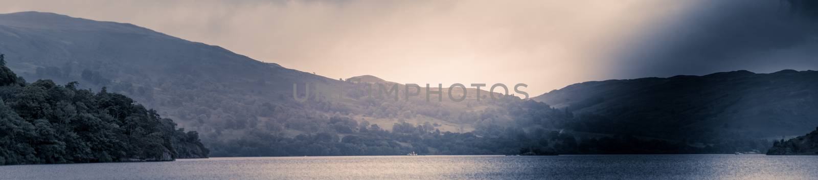 view of stormy skies north east across ullswater from glenridding