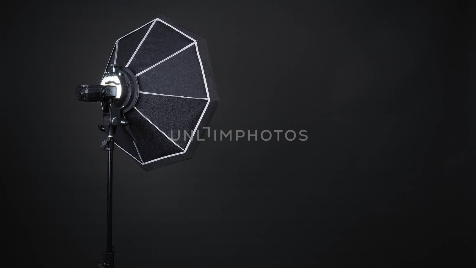 Professional photo studio soft box and flash on the tripod by gnepphoto