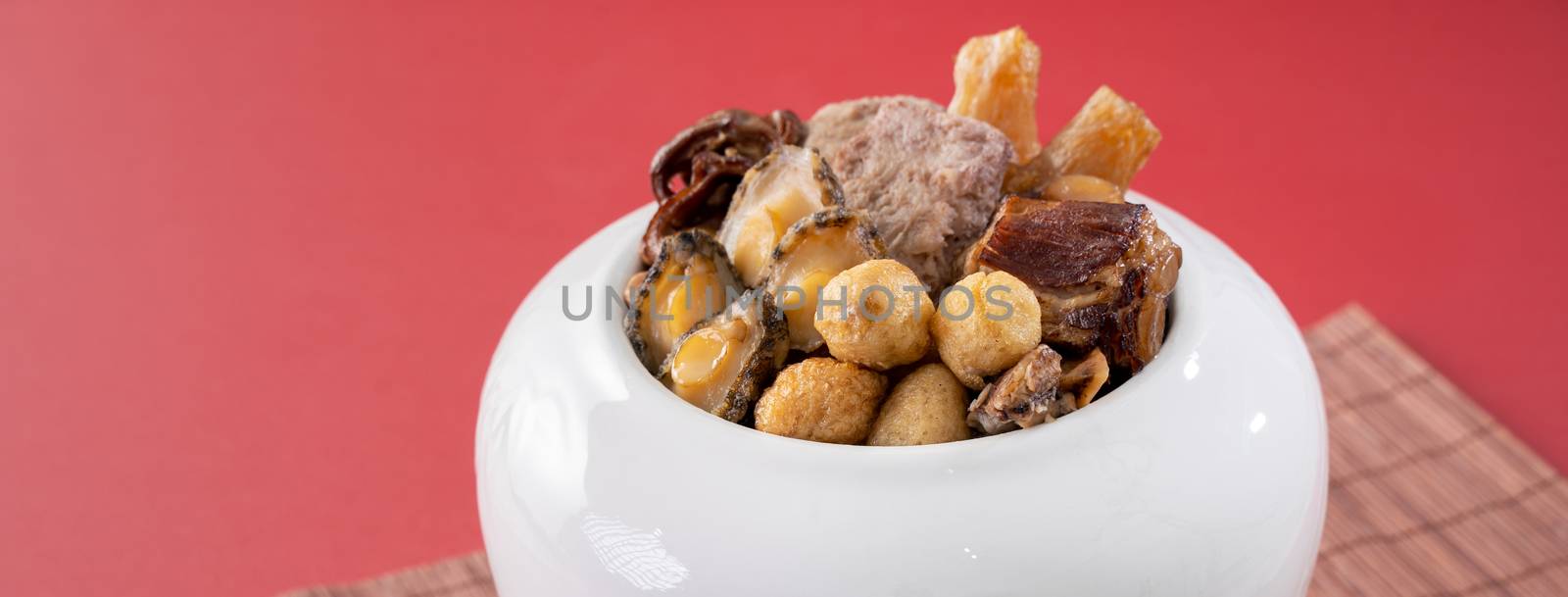 Traditional food of Chinese lunar new year, Buddha jumps over the wall, Chinese Soup Casserole dish, Buddha's Temptation, named Fo Tiao Qiang, close up.