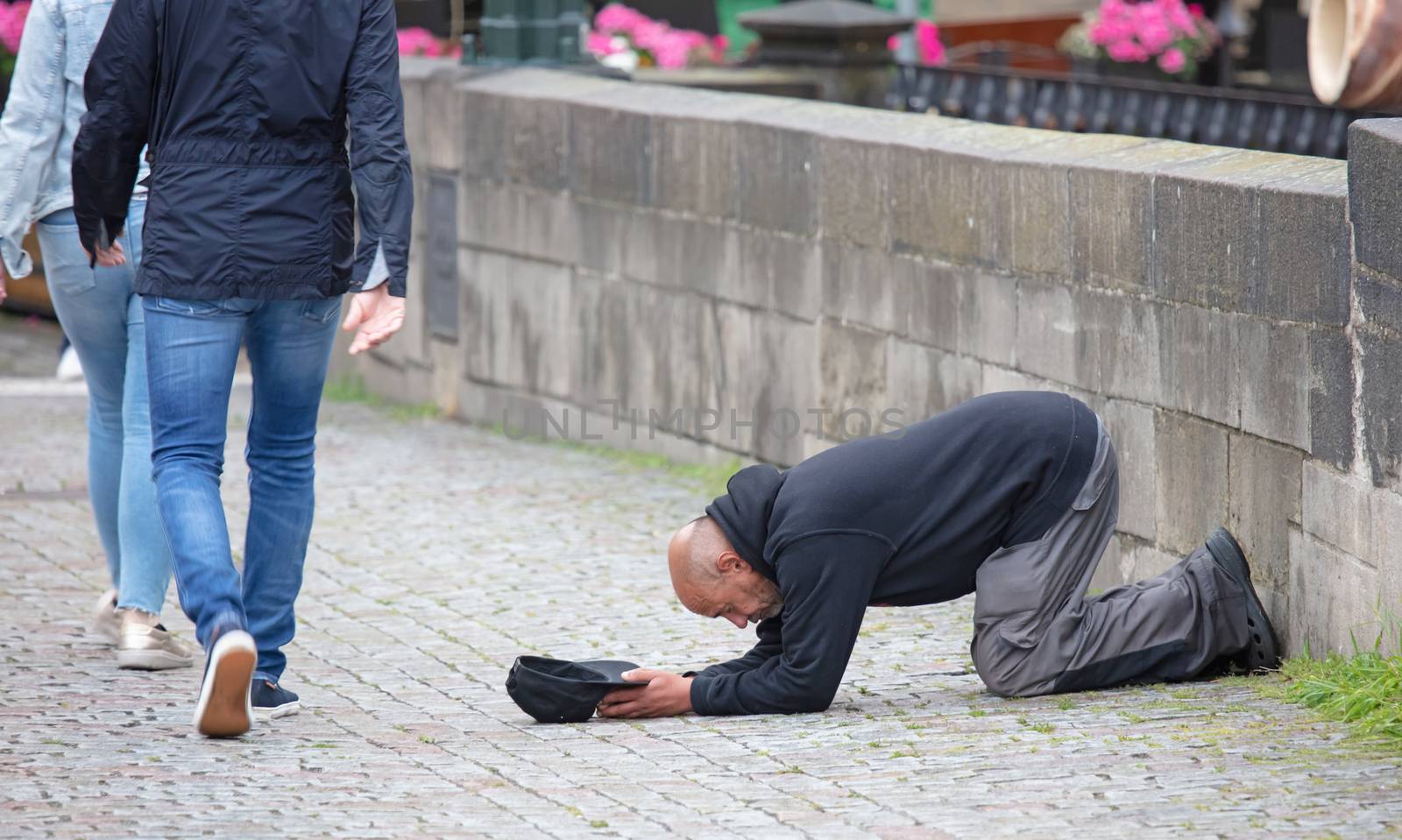 Prague, Czech Republic on july 8, 2020: Beggar begging for alms on the street in Prague