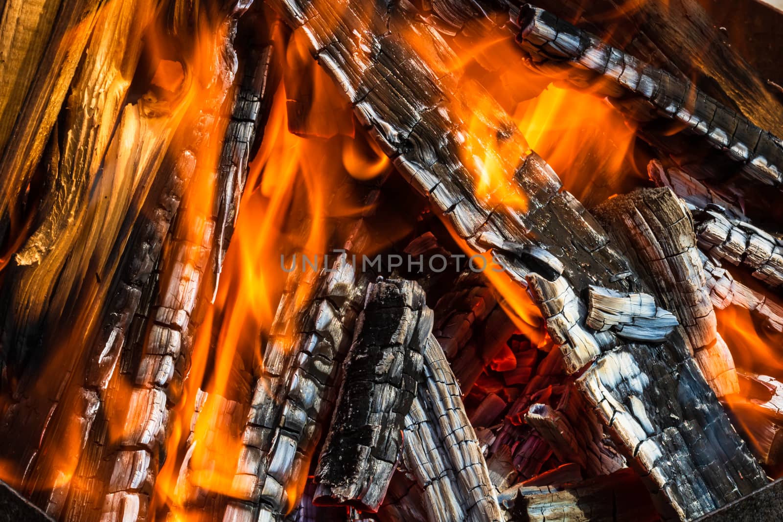 Burning wood chips forming coal. Barbecue preparation, fire before cooking. Hot coal made of greatly heated wood.
