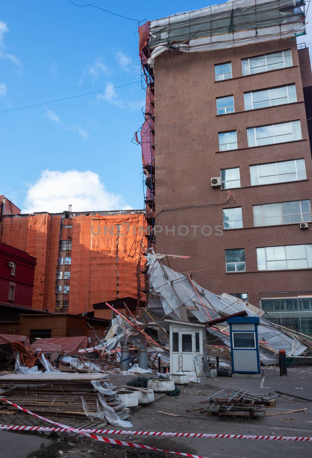 Scaffolding collapsed from a strong wind near a reconstructed multi-storey building in the city center.
