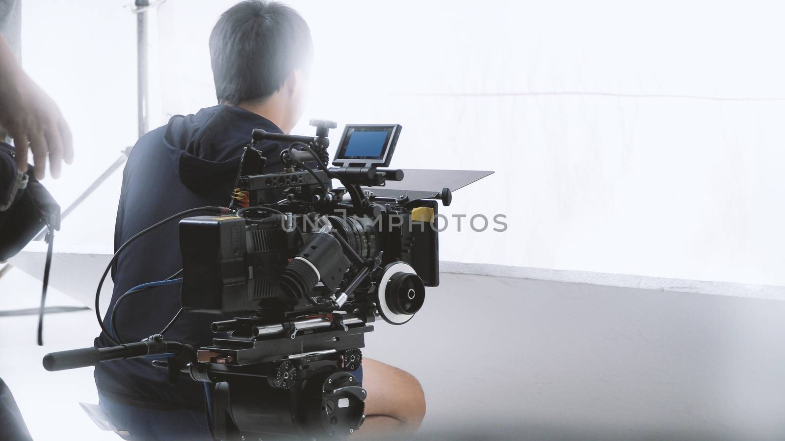 Behind video camera that recording online commercial by gnepphoto