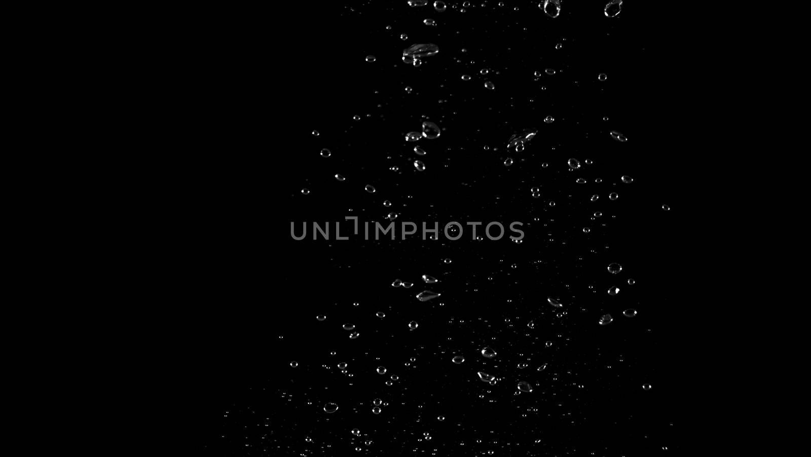 Extream close-up images of water bubbles or soda or liquid texture that splashing and floating up to surface like a explosion in black color background for refreshing carbonate drink concept.