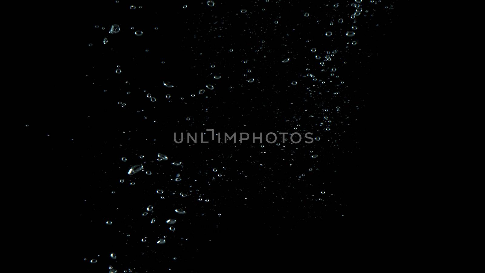 Extream close-up images of water bubbles or soda or liquid texture that splashing and floating up to surface like a explosion in black color background for refreshing carbonate drink concept.