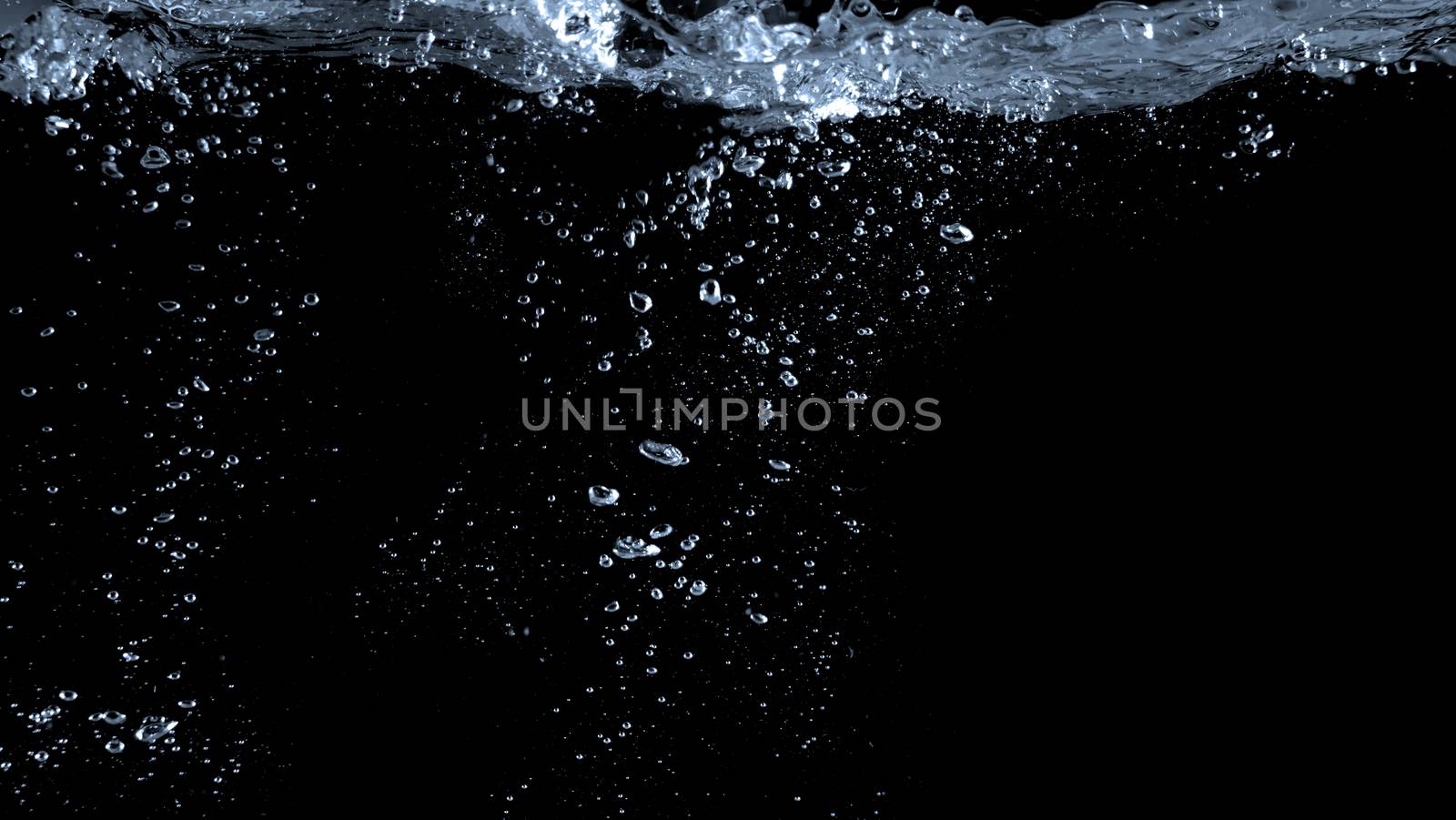 Blurry images of soda liquid water bubbles or carbonate drink or oil shape or beer fizzing or splashing and floating drop in black background for represent sparkling and refreshing