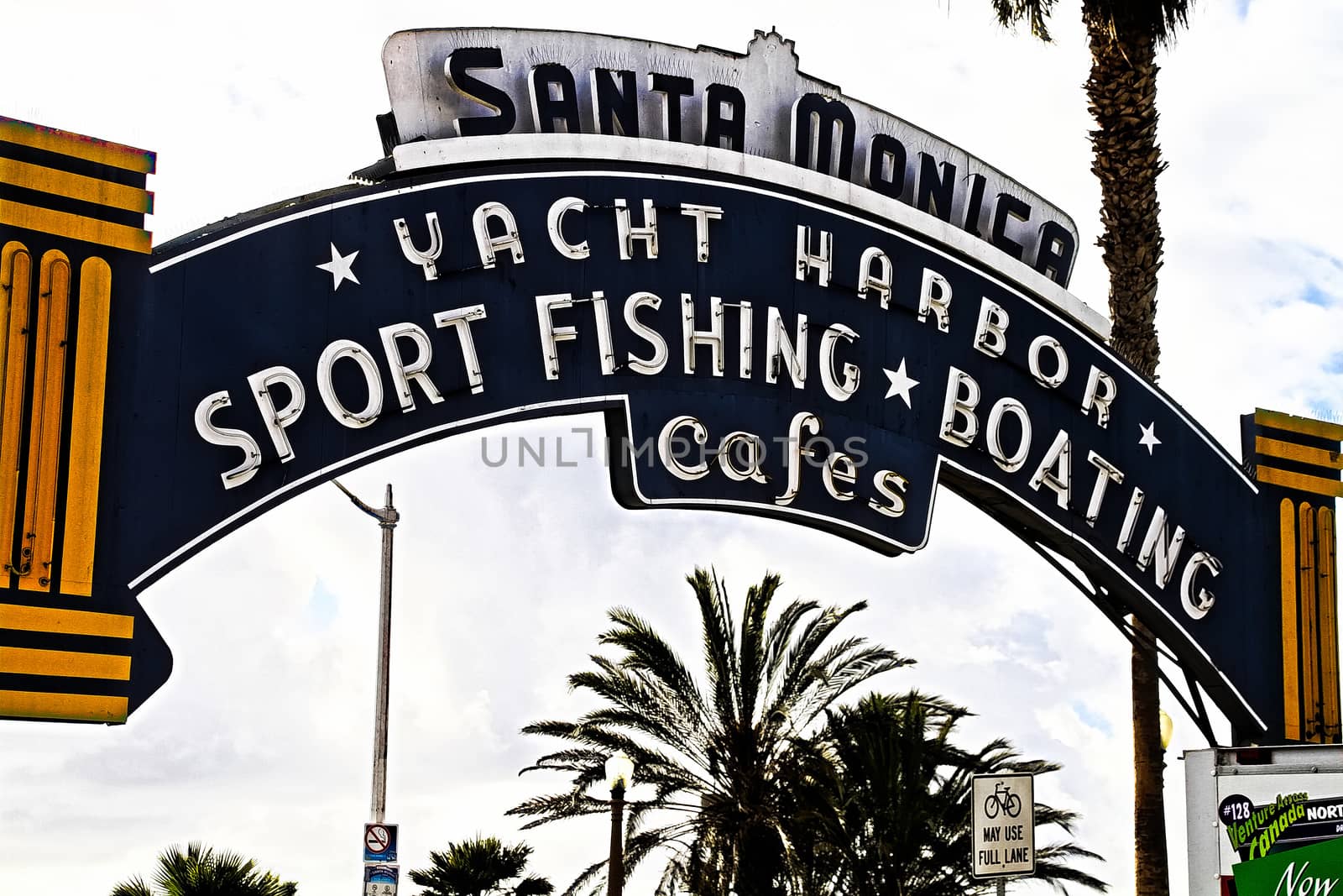 Los Angeles,CA/USA - Oct 29, 2015 : Welcoming arch in Santa Monica, California. The city has 3.5 miles of beach locations.Santa Monica Pier, Picture of the entrance with the famous arch sign. by USA-TARO