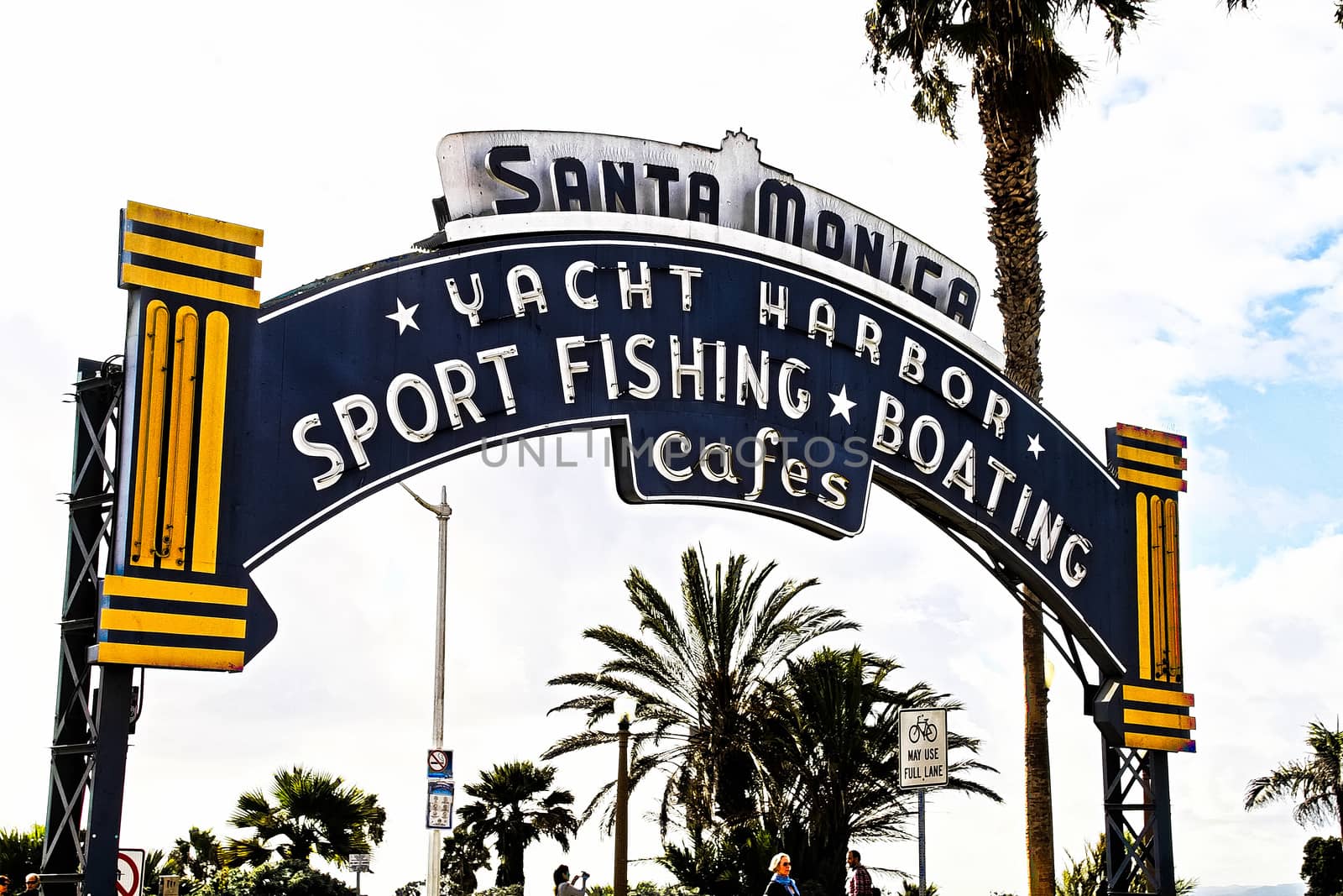 Los Angeles,CA/USA - Oct 29, 2015 : Welcoming arch in Santa Monica, California. The city has 3.5 miles of beach locations.Santa Monica Pier, Picture of the entrance with the famous arch sign. by USA-TARO