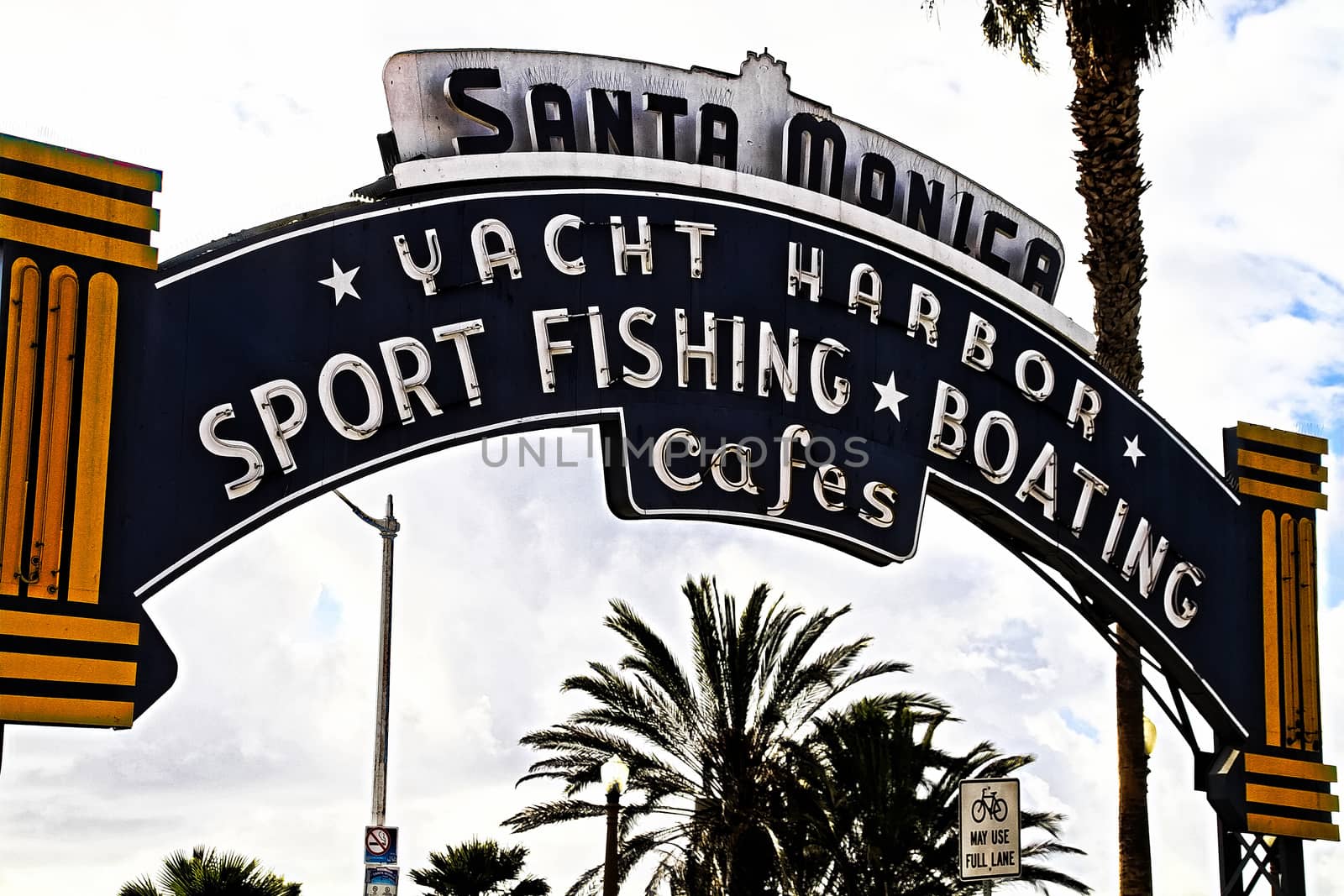 Los Angeles,CA/USA - Oct 29, 2015 : Welcoming arch in Santa Monica, California. The city has 3.5 miles of beach locations.Santa Monica Pier, Picture of the entrance with the famous arch sign. by USA-TARO