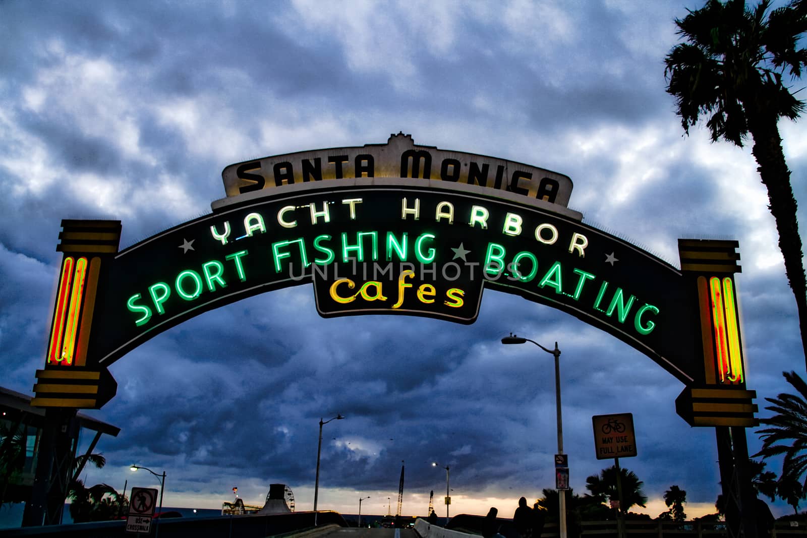 Los Angeles,CA/USA - Oct 29, 2015 : Welcoming arch in Santa Monica, California. The city has 3.5 miles of beach locations.Santa Monica Pier, Picture of the entrance with the famous arch sign. by USA-TARO