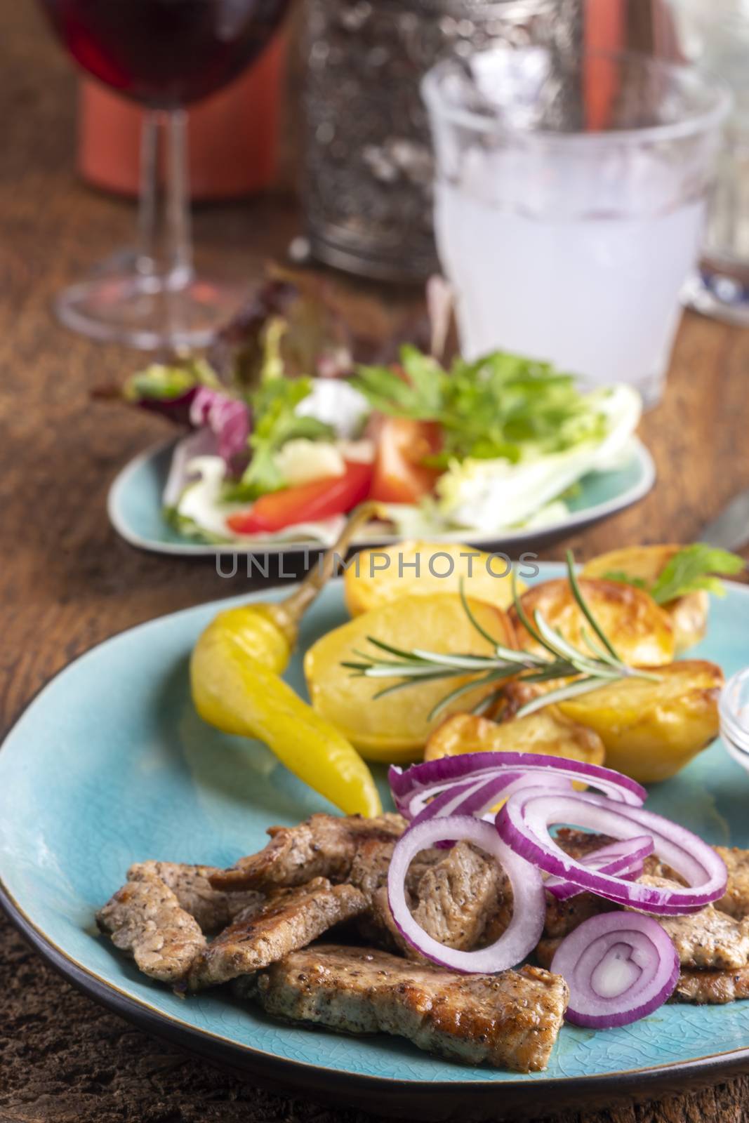 greek gyros with salad and ouzo