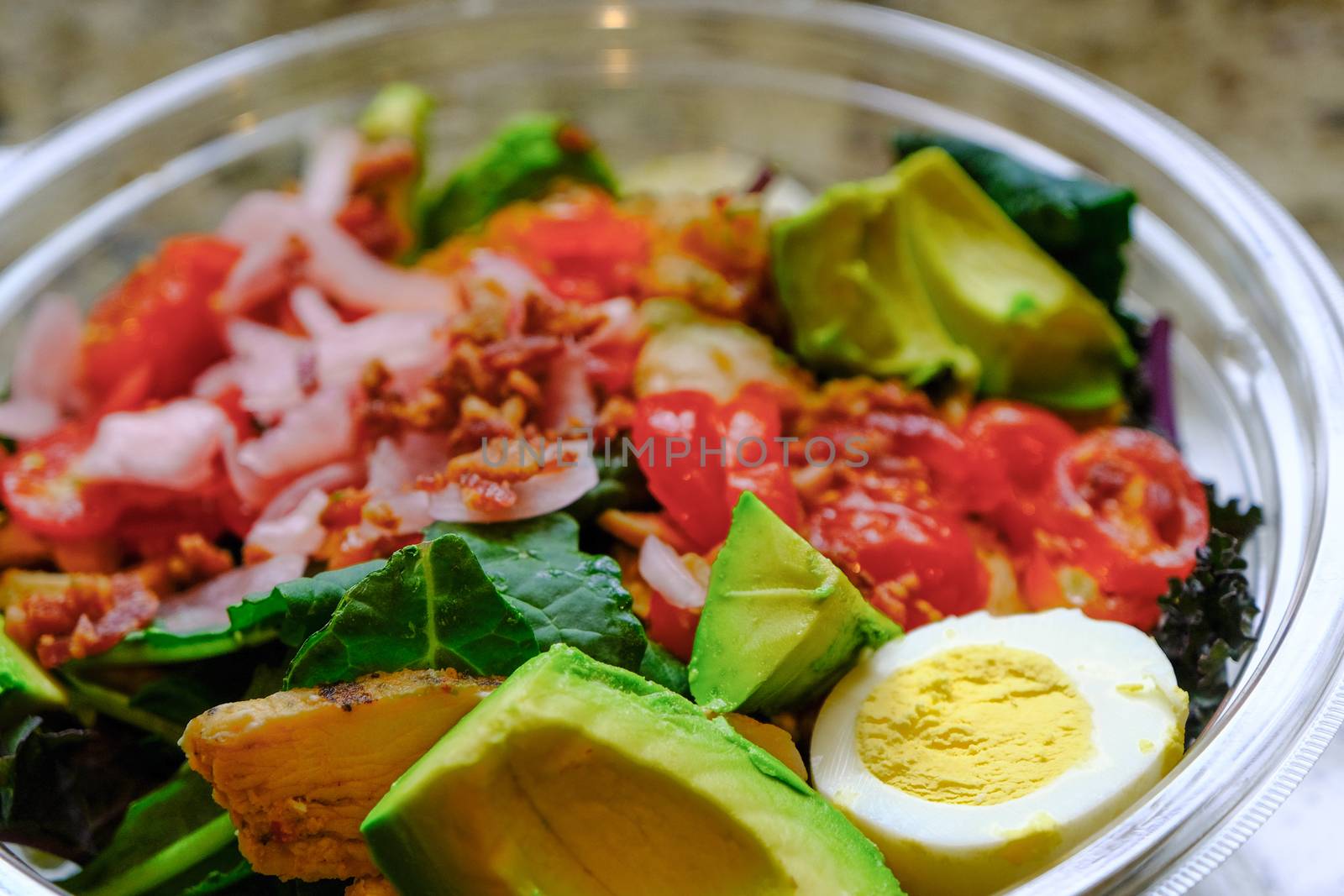 Fresh Cobb Salad in a Clear Plastic Bowl