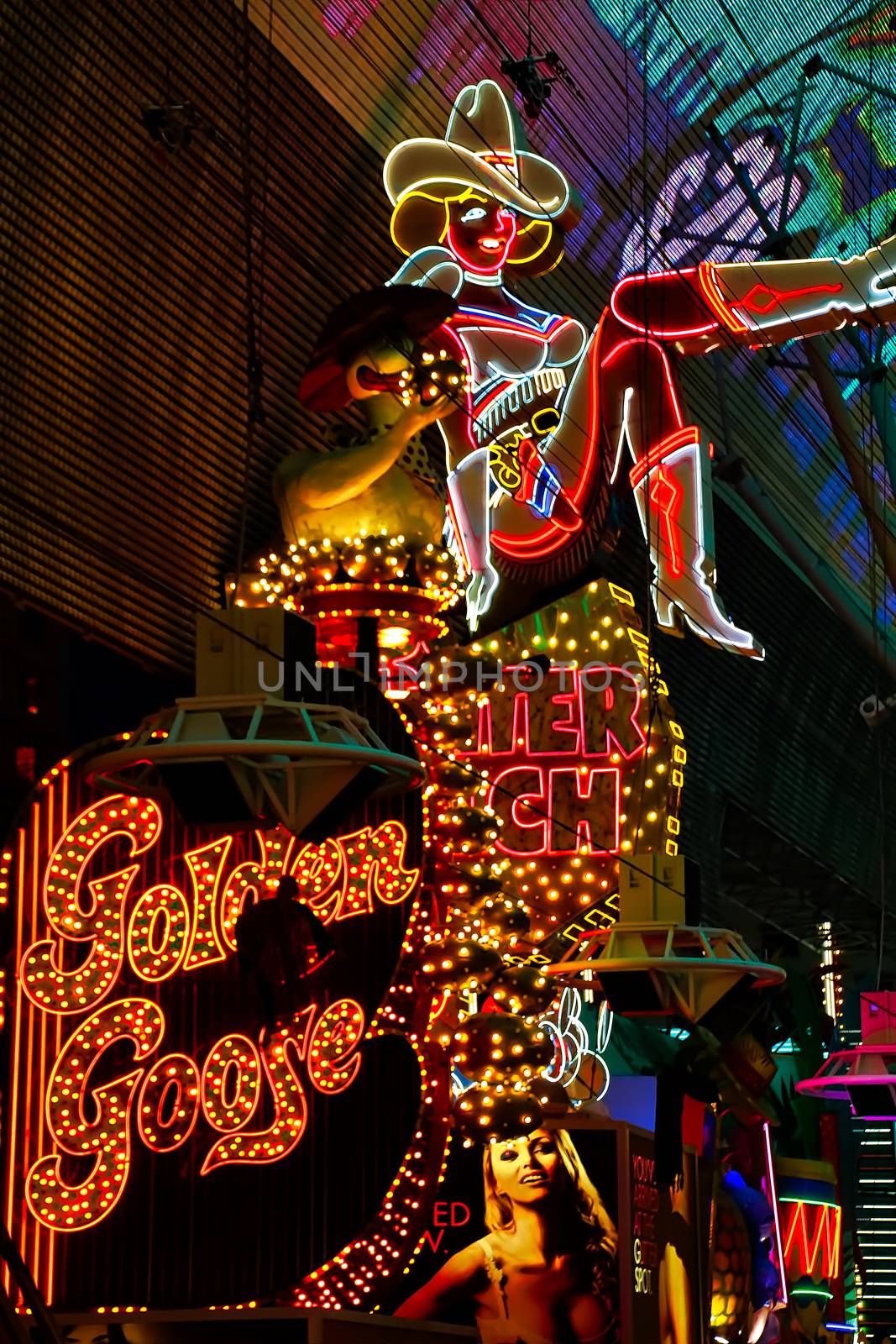 Las Vegas,NV/USA - Sep 12,2018 : Cowgirl neon sign in downtown Las Vegas. The iconic sign of Glitter Gulch is placed in 20 East Fremont Street, in Downtown Las Vegas by USA-TARO