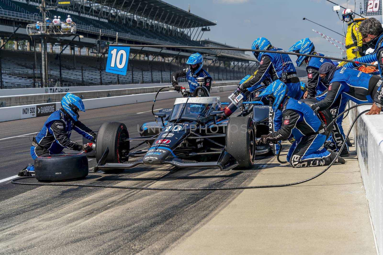 FELIX ROSENQVIST (10) of Varnamo, Sweden brings his car in for service during the Indianapolis 500 at Indianapolis Motor Speedway in Indianapolis Indiana.