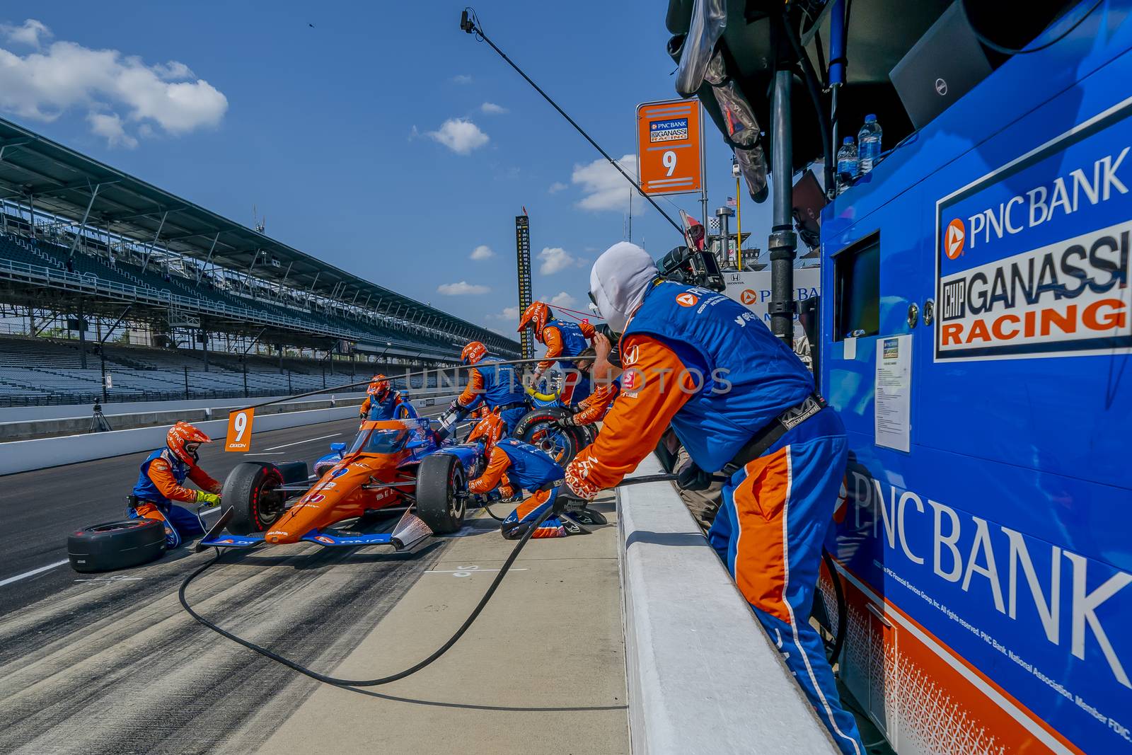 SCOTT DIXON (9) of Auckland, New Zealand brings his car in for service during the Indianapolis 500 at Indianapolis Motor Speedway in Indianapolis Indiana.