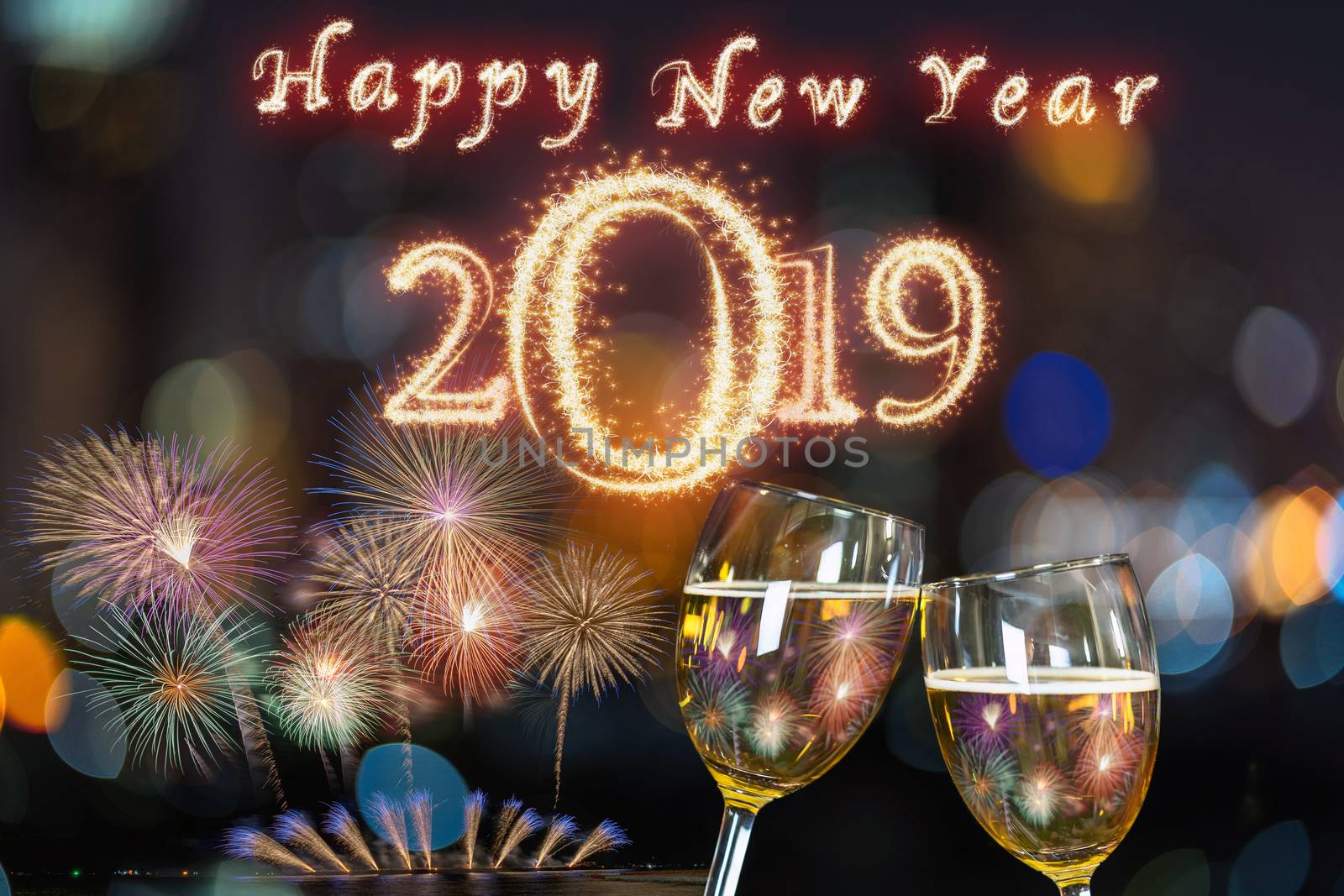 Happy new year 2019 written with Sparkle firework on Clinking with two beer mug or glasses over the photo blurred of cityscape for celebrate, party and celebrate with happy new year concept