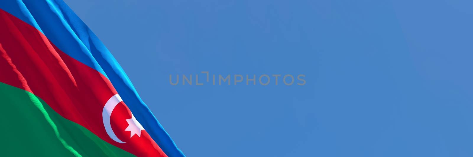 3D rendering of the national flag of Azerbaijan waving in the wind against a blue sky