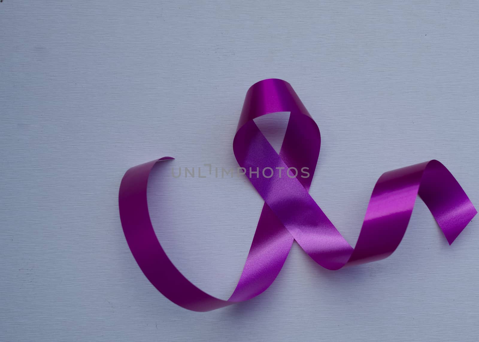 Close-up pink ribbon breast cancer awareness day campaign symbol by noppha80