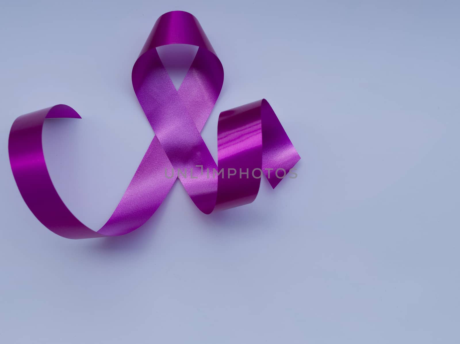 Close-up pink ribbon breast cancer awareness day campaign symbol by noppha80