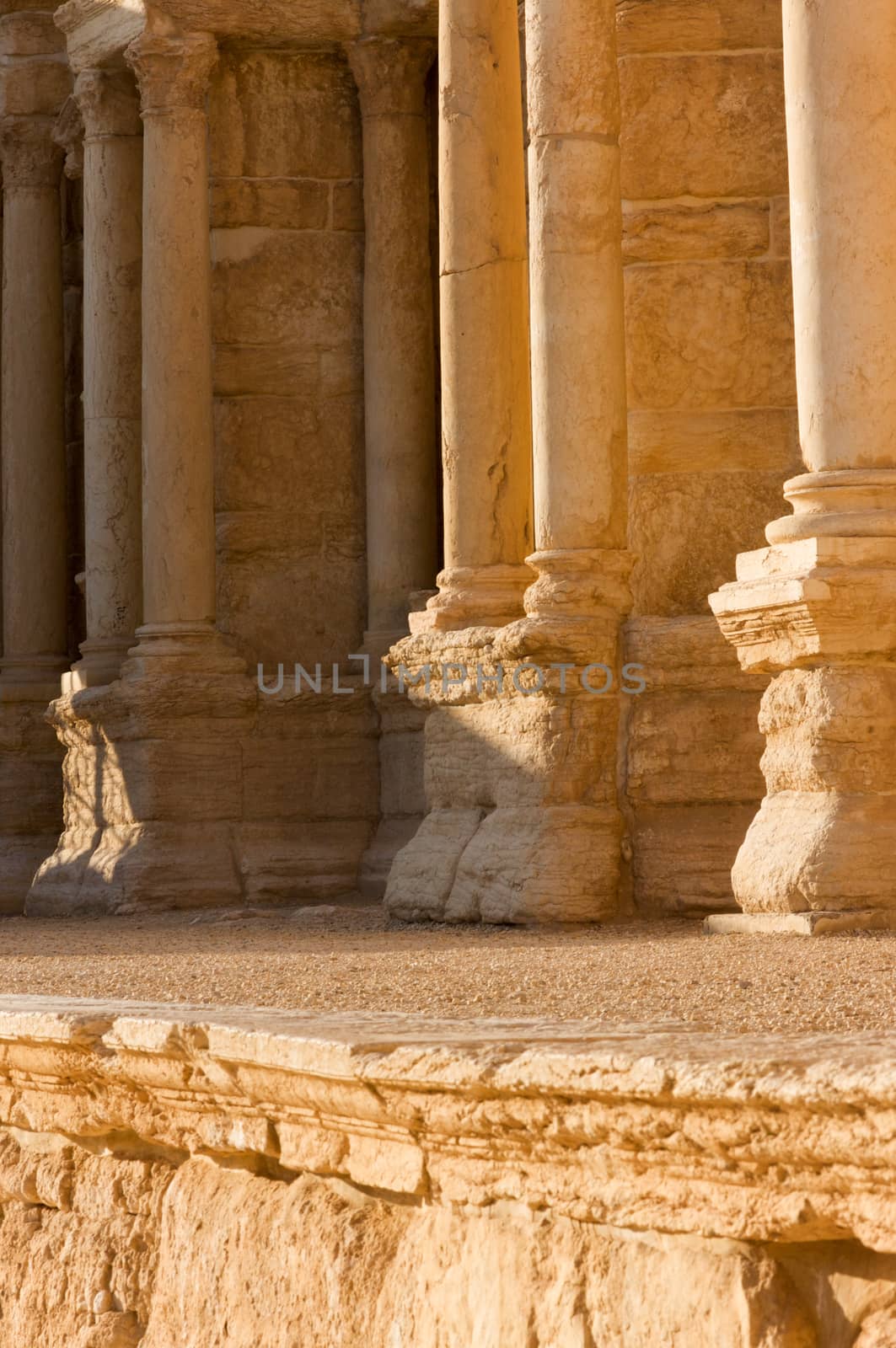 Palmyre Syria 2009 This ancient site has many Roman ruins, these standing columns shot in late afternoon sun with the citadel on the hill in the background . High quality photo