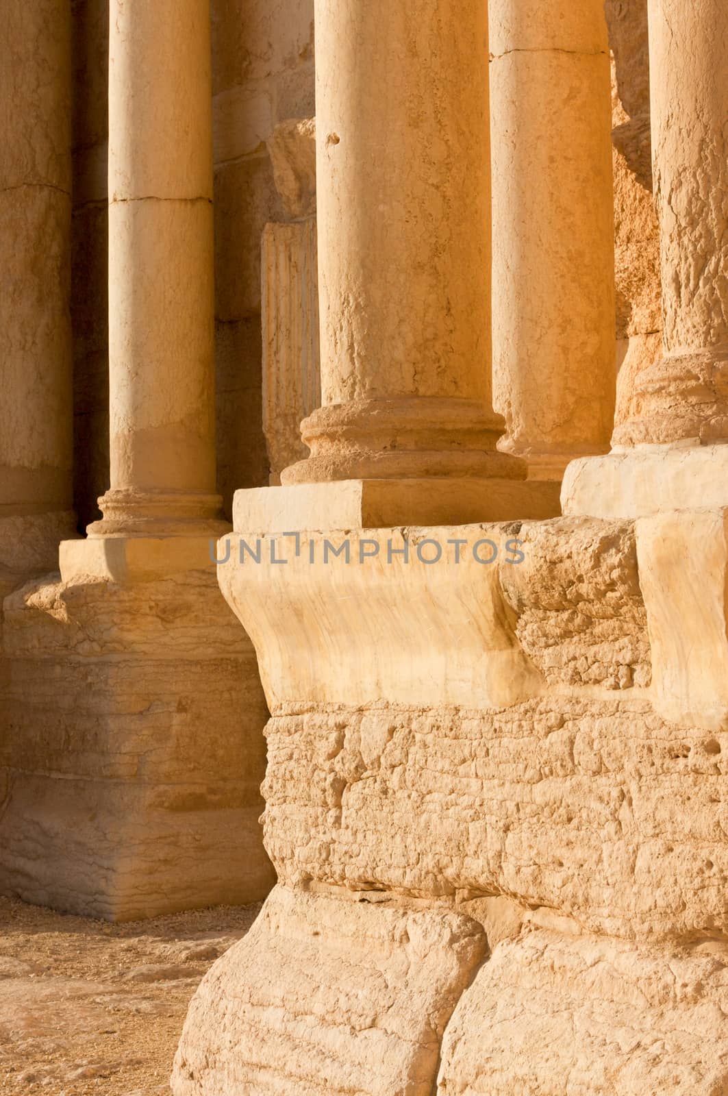 Palmyre Syria 2009 This ancient site has many Roman ruins, these standing columns shot in late afternoon sun with the citadel on the hill in the background . High quality photo