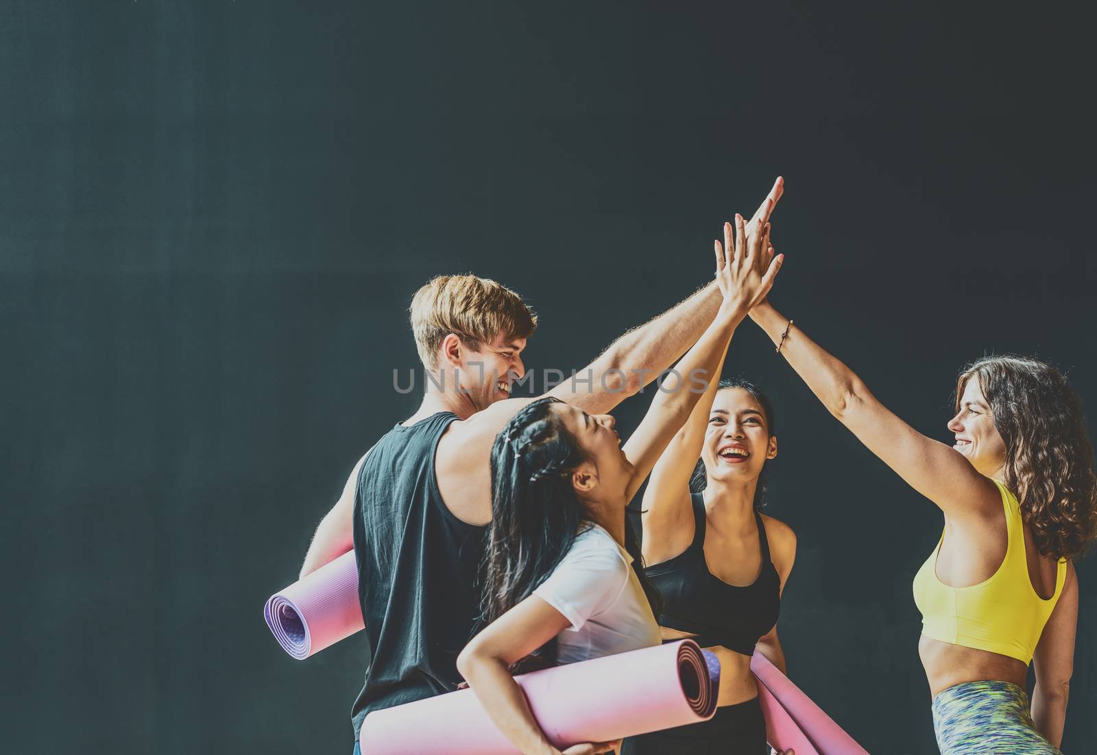 Group of diversity sporty people talking and celebrating by give me five with happiness, wearing sportswear bra and pants fashion, posture position, sport club community, sports and healthcare concept