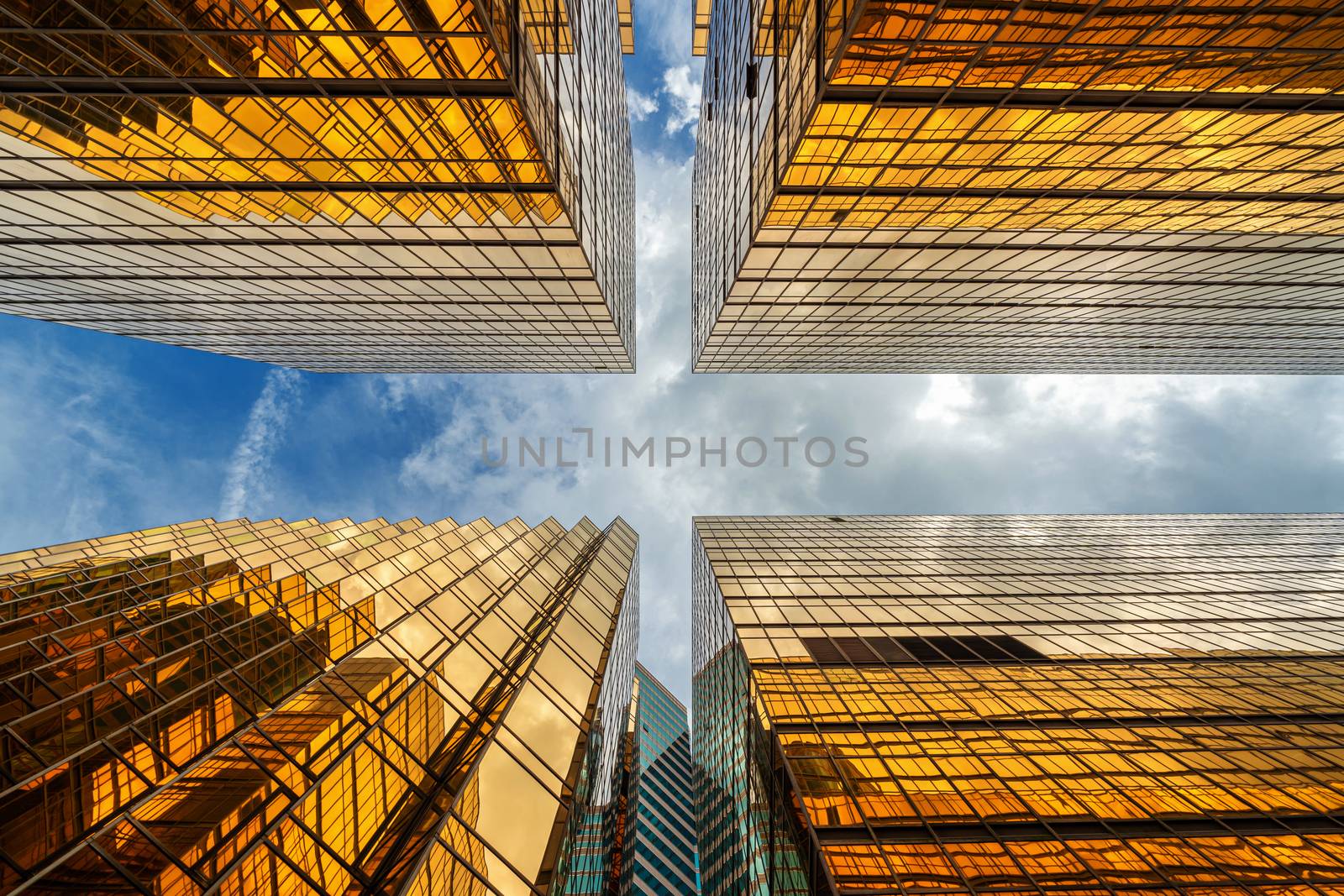 Uprisen angle of Hong Kong skyscraper with reflection of clouds by Tzido
