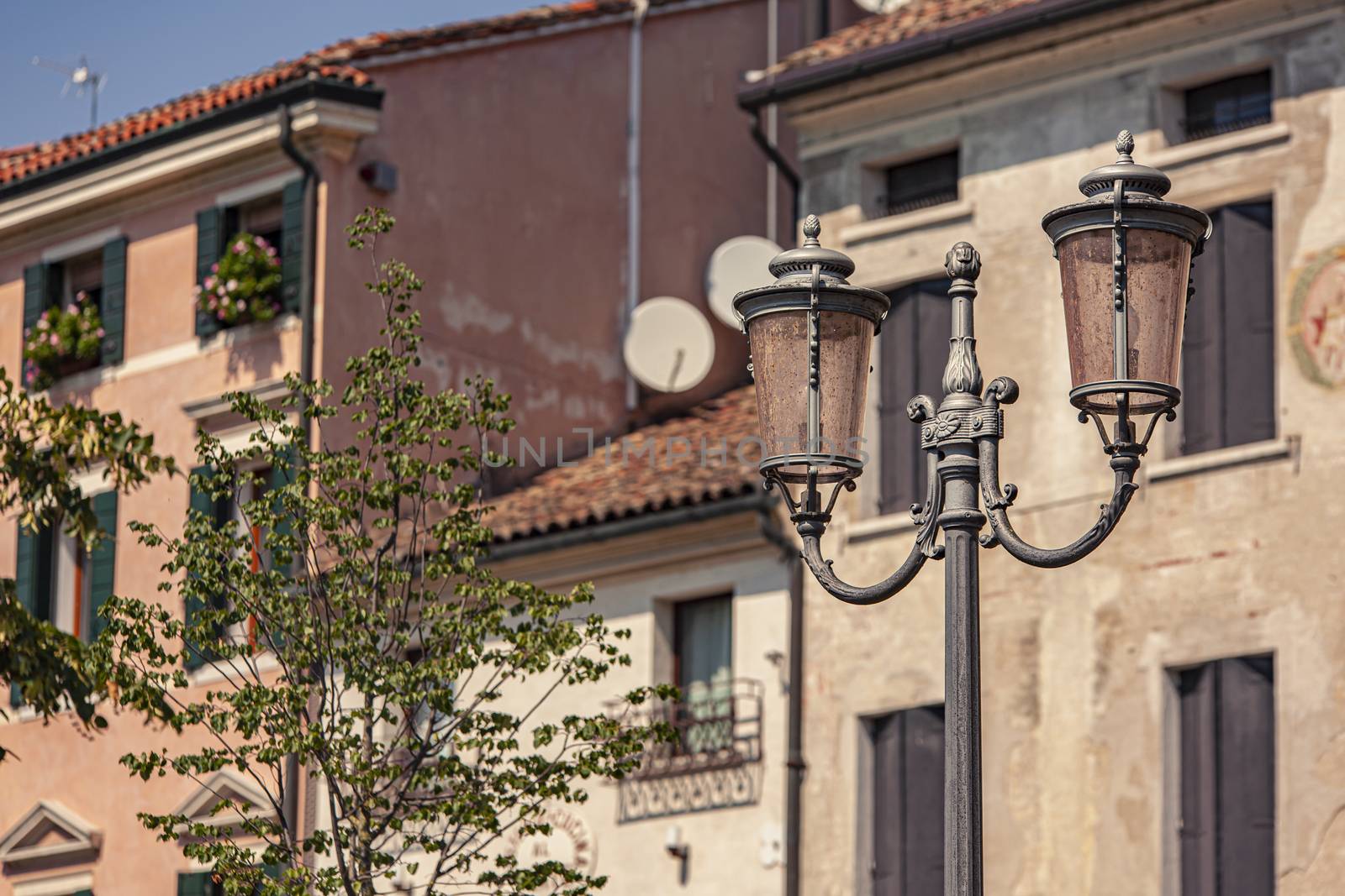 Architecture detail with street lamp in Treviso in Italy