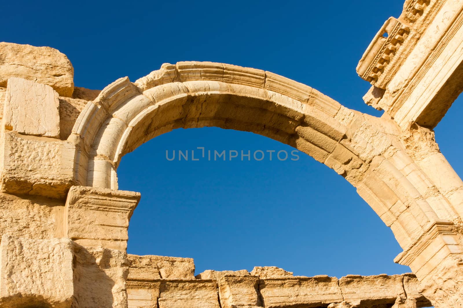 Palmyre Syria 2009 This ancient site has many Roman ruins, the arch of triumph shot in late afternoon sun with deep blue sky . High quality photo