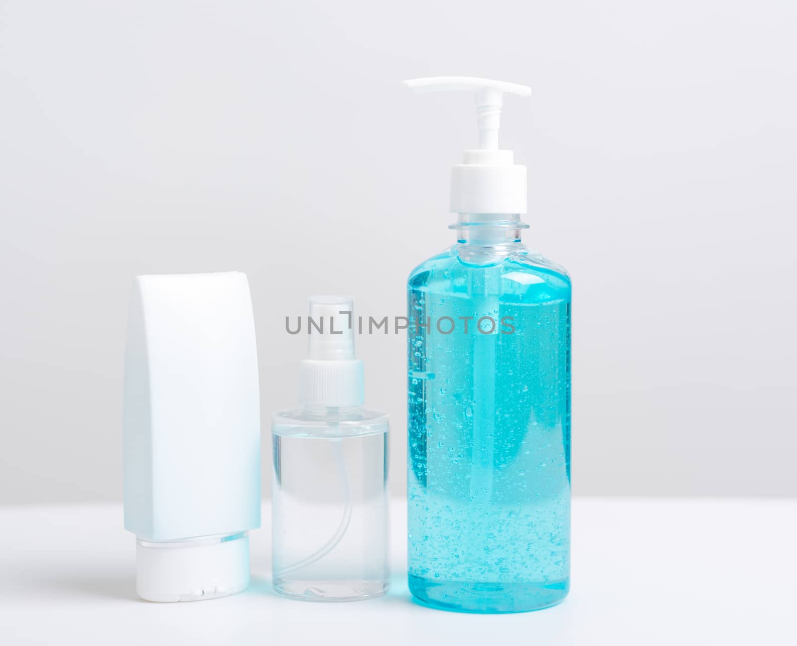 Plastic dispenser sanitizer alcohol gel pump and spray bottle for washing hand hygiene prevention of coronavirus virus studio shot on white background