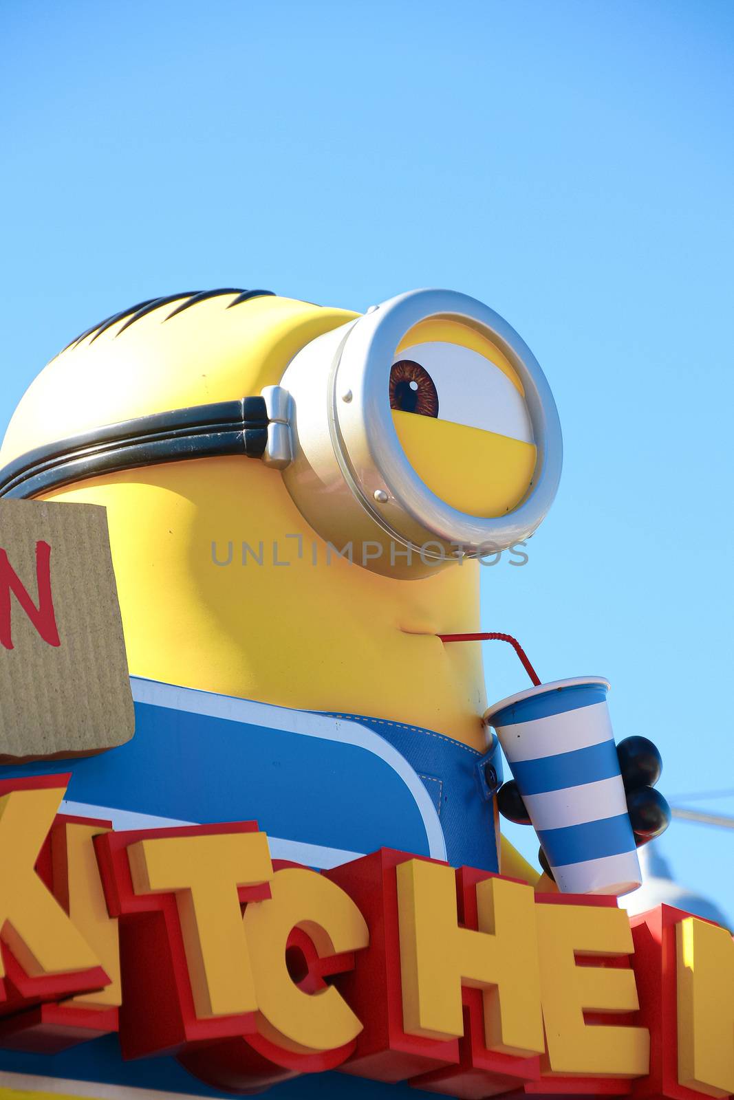 OSAKA, JAPAN - Feb 19, 2020 : Statue of "HAPPY MINION", located in Universal Studios Japan, Osaka, Japan. Minions are famous character from Despicable Me animation. by USA-TARO