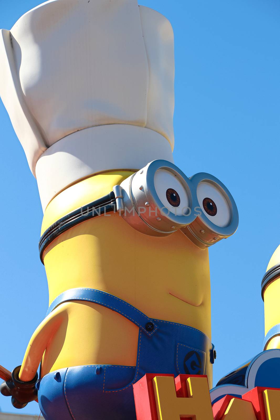 OSAKA, JAPAN - Feb 19, 2020 : Statue of "HAPPY MINION", located in Universal Studios Japan, Osaka, Japan. Minions are famous character from Despicable Me animation.