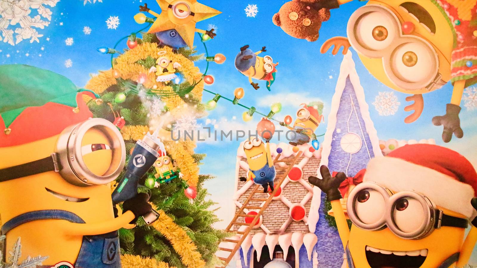 OSAKA, JAPAN - Nov 13, 2019 : Close up of Christmas Happy holiday version of HAPPY MINION statue in Universal Studios Japan. Minions are famous character from Despicable Me animation. by USA-TARO