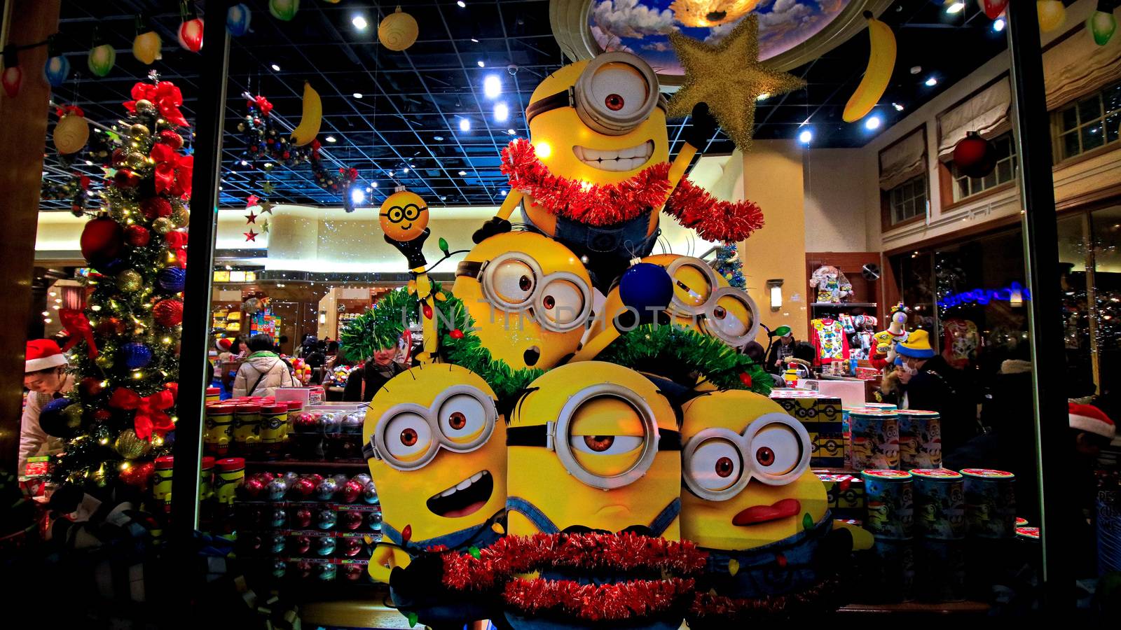 OSAKA, JAPAN - Nov 13, 2019 : Close up of Christmas Happy holiday version of HAPPY MINION statue in Universal Studios Japan. Minions are famous character from Despicable Me animation.