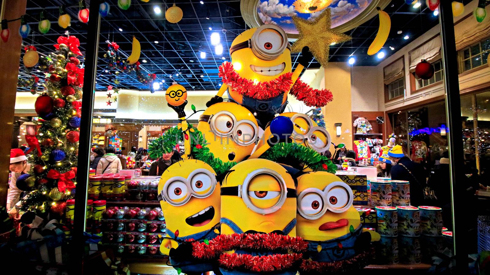 OSAKA, JAPAN - Nov 13, 2019 : Close up of Christmas Happy holiday version of HAPPY MINION statue in Universal Studios Japan. Minions are famous character from Despicable Me animation. by USA-TARO