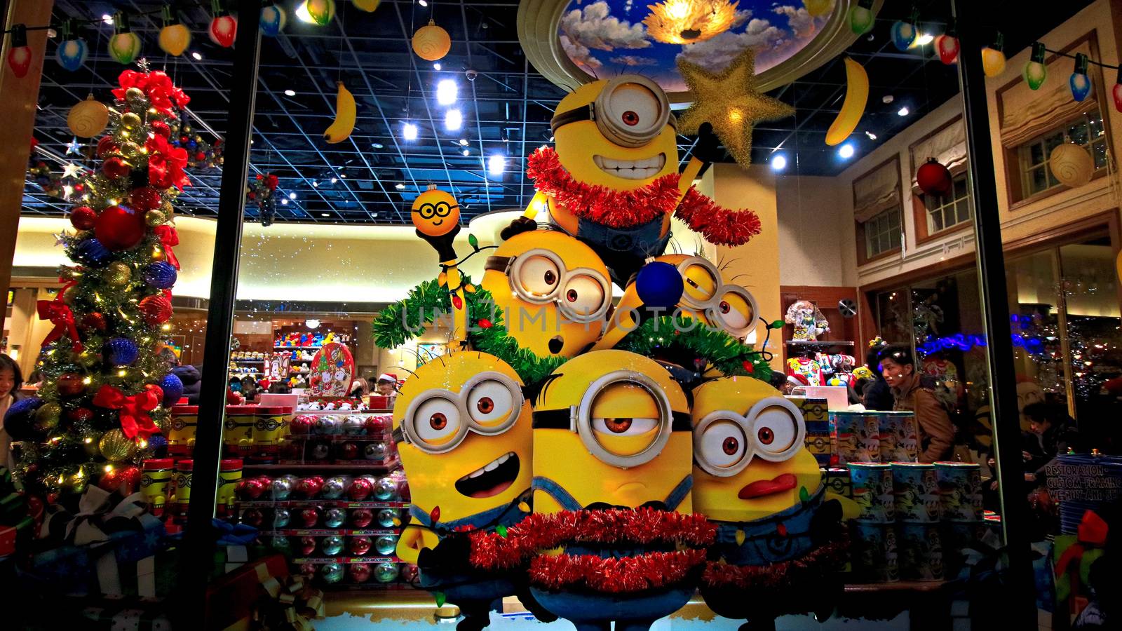 OSAKA, JAPAN - Nov 13, 2019 : Close up of Christmas Happy holiday version of HAPPY MINION statue in Universal Studios Japan. Minions are famous character from Despicable Me animation. by USA-TARO