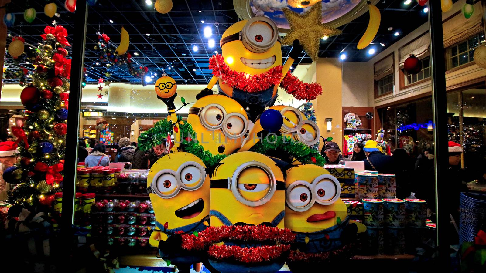 OSAKA, JAPAN - Nov 13, 2019 : Close up of Christmas Happy holiday version of HAPPY MINION statue in Universal Studios Japan. Minions are famous character from Despicable Me animation.