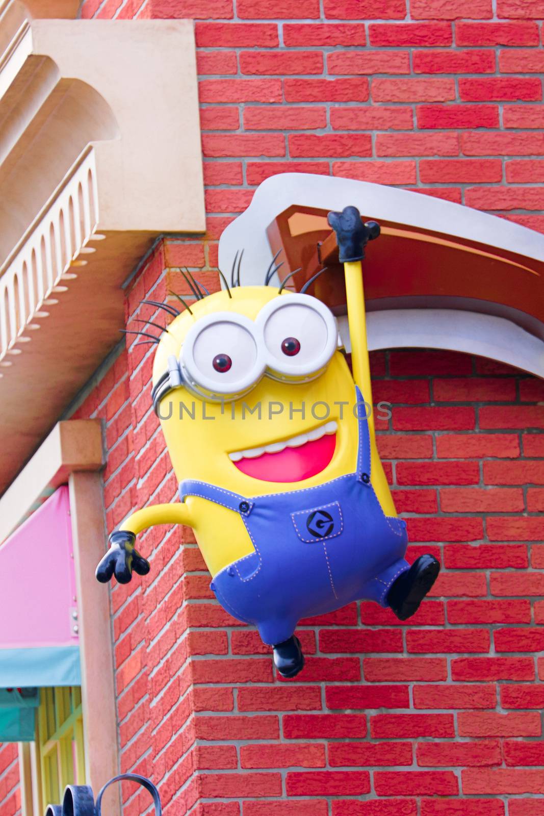 OSAKA, JAPAN - Feb 29, 2020 : Close up of HAPPY MINION statue, located in Universal Studios Japan. Minions are famous character from Despicable Me animation. by USA-TARO