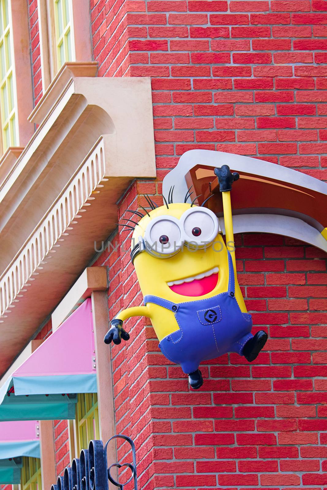 OSAKA, JAPAN - Feb 29, 2020 : Close up of HAPPY MINION statue, located in Universal Studios Japan. Minions are famous character from Despicable Me animation. by USA-TARO