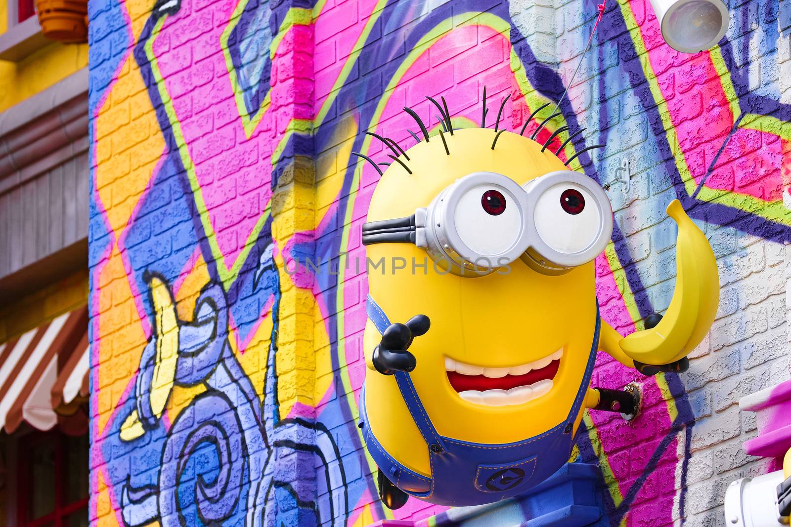 OSAKA, JAPAN - Feb 29, 2020 : Close up of HAPPY MINION statue, located in Universal Studios Japan. Minions are famous character from Despicable Me animation. by USA-TARO