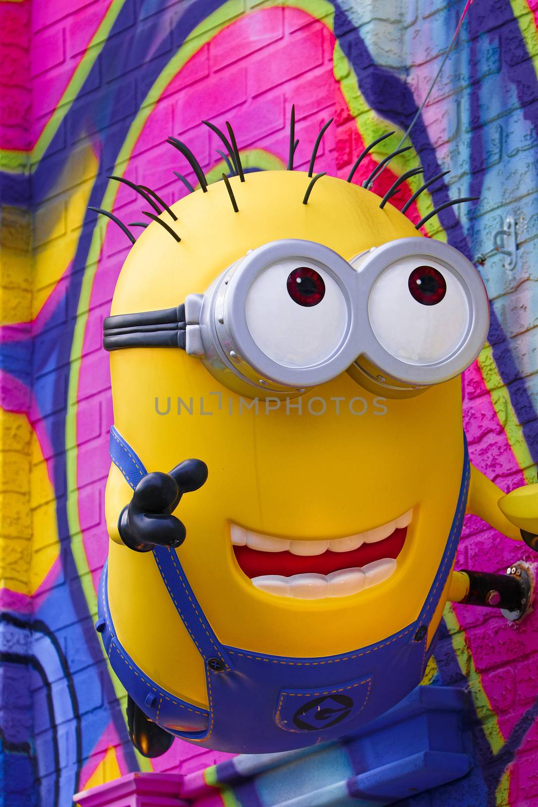 OSAKA, JAPAN - Feb 29, 2020 : Close up of HAPPY MINION statue, located in Universal Studios Japan. Minions are famous character from Despicable Me animation. by USA-TARO