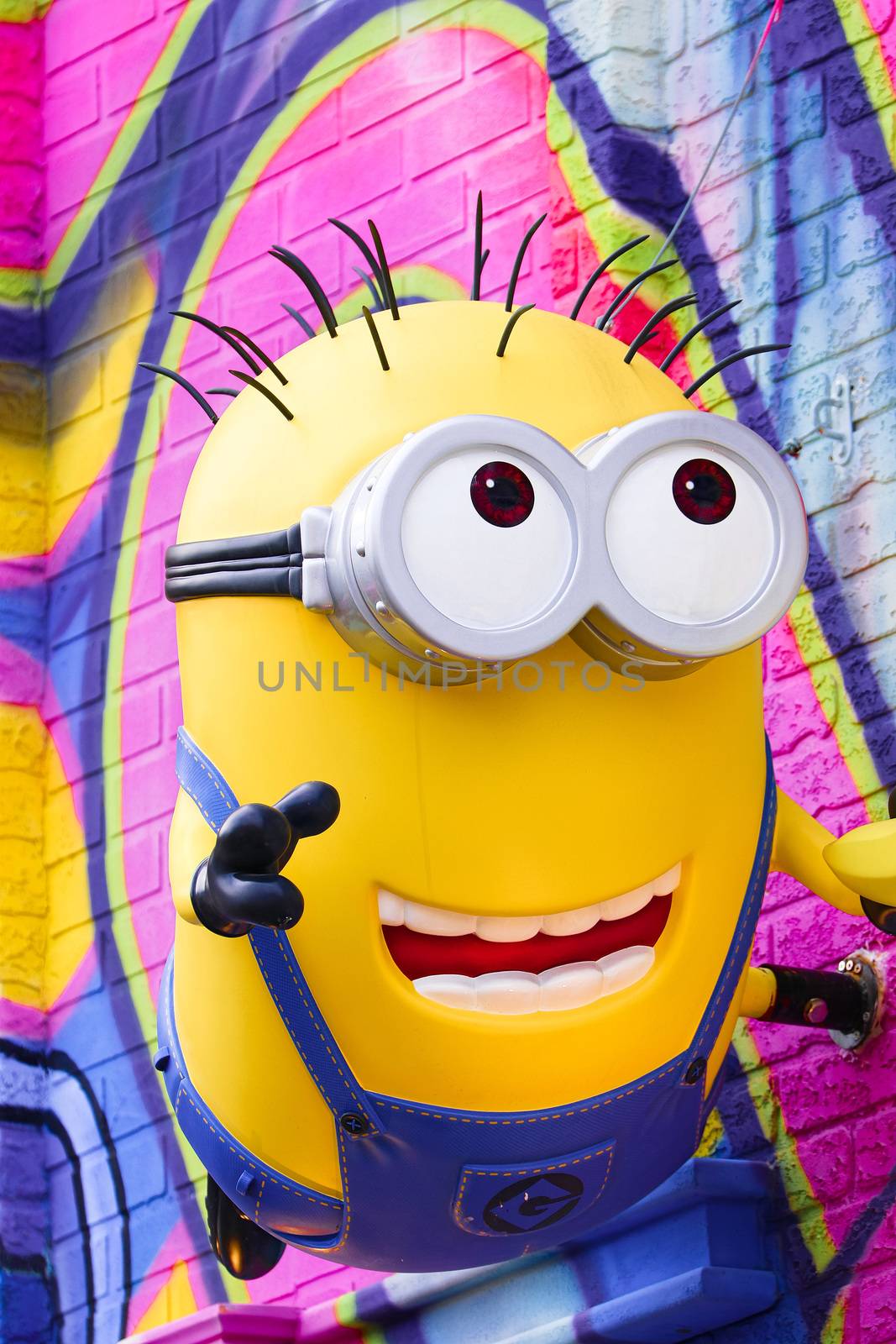 OSAKA, JAPAN - Feb 29, 2020 : Close up of HAPPY MINION statue, located in Universal Studios Japan. Minions are famous character from Despicable Me animation. by USA-TARO