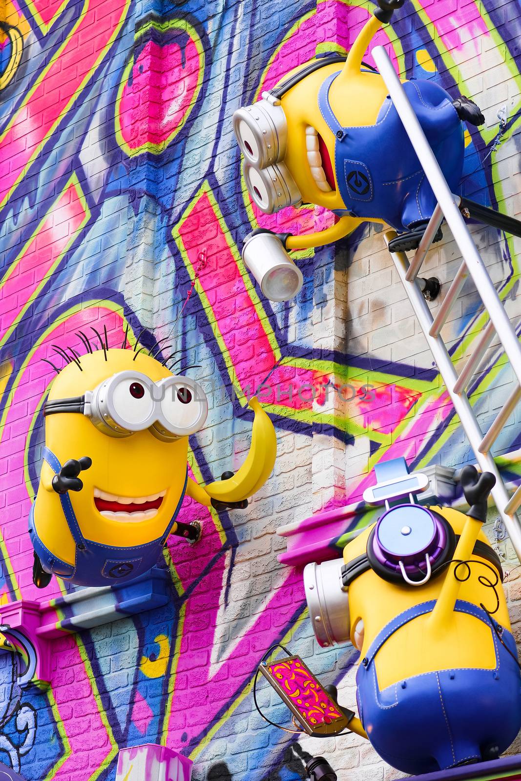 OSAKA, JAPAN - Feb 29, 2020 : Close up of HAPPY MINION statue, located in Universal Studios Japan. Minions are famous character from Despicable Me animation. by USA-TARO