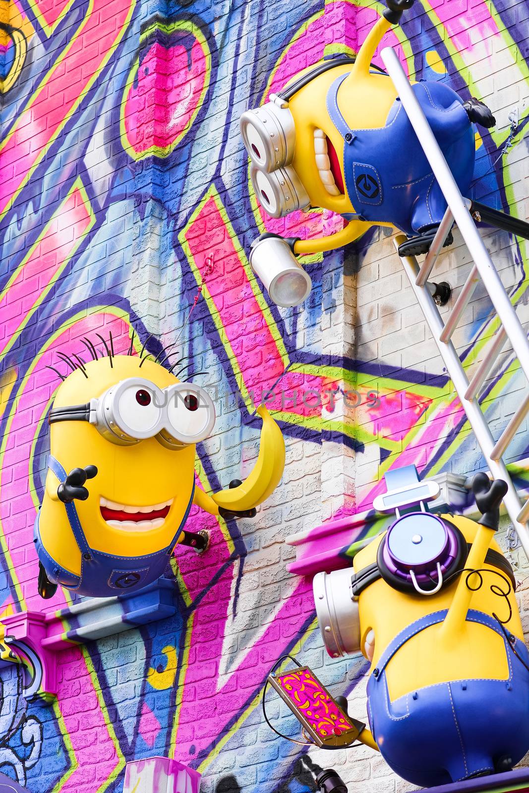 OSAKA, JAPAN - Feb 29, 2020 : Close up of HAPPY MINION statue, located in Universal Studios Japan. Minions are famous character from Despicable Me animation. by USA-TARO