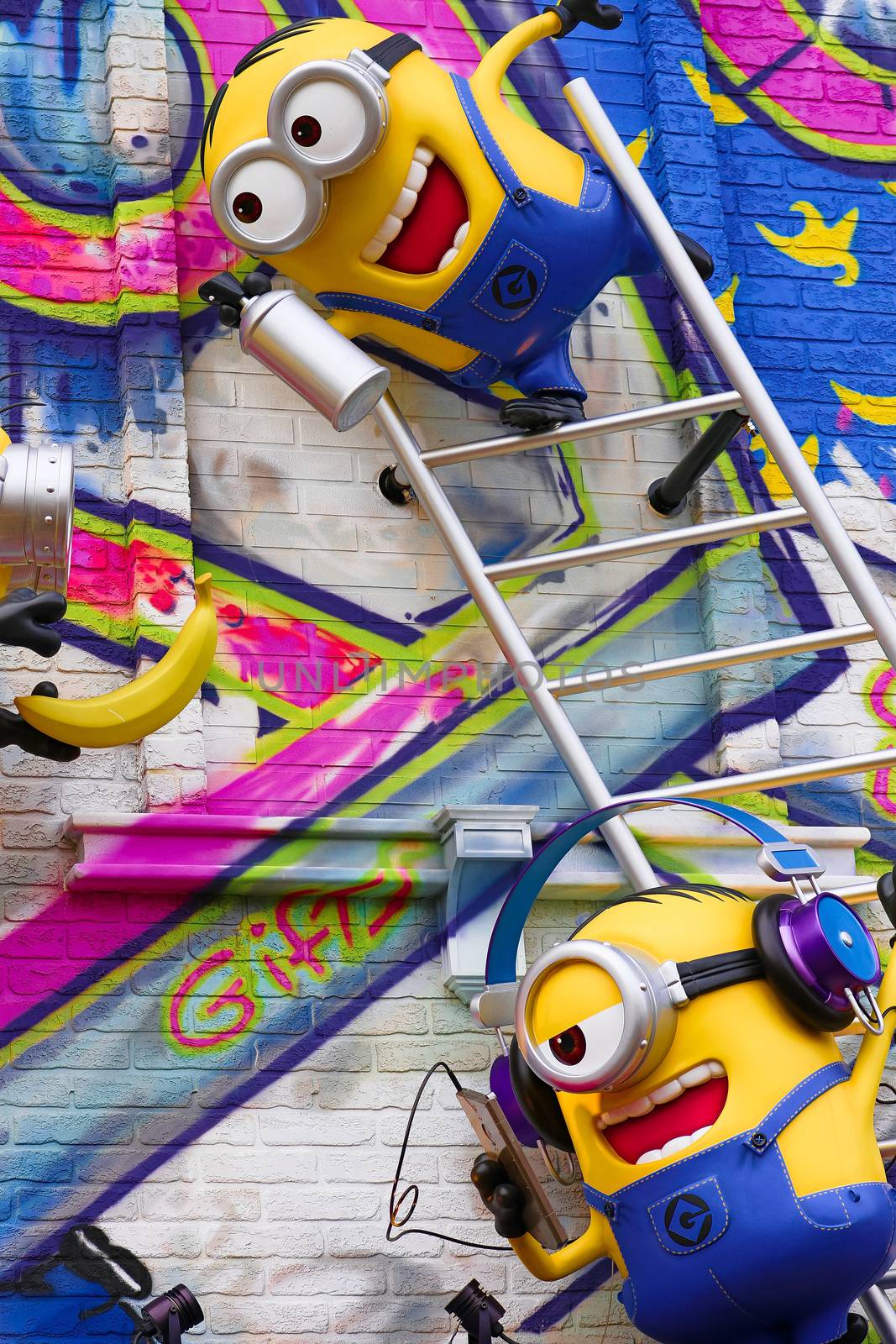 OSAKA, JAPAN - Feb 29, 2020 : Close up of HAPPY MINION statue, located in Universal Studios Japan. Minions are famous character from Despicable Me animation. by USA-TARO