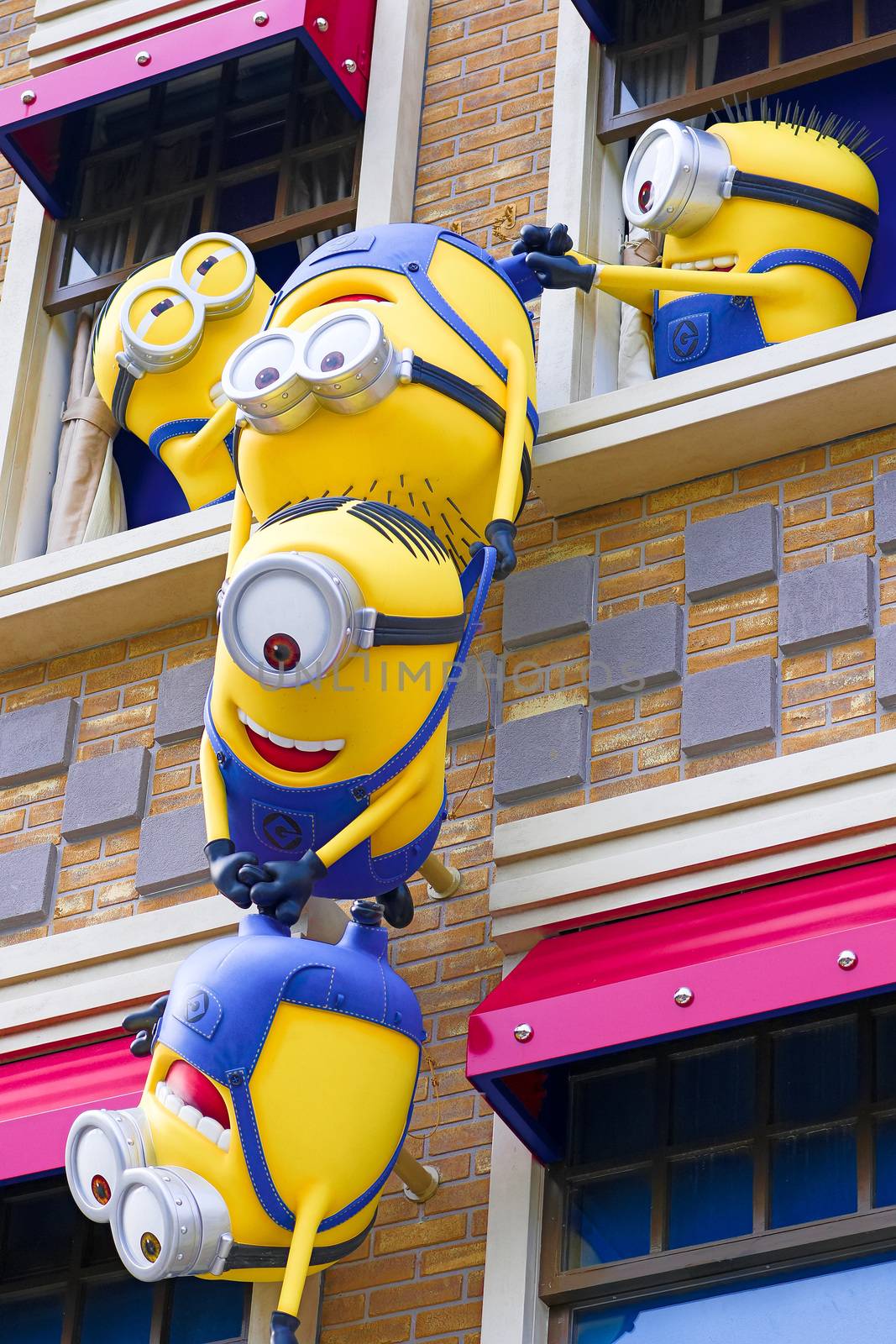 SAKA, JAPAN - June 24, 2017 : Statue of "HAPPY MINION", located in Universal Studios Japan, Osaka, Japan. Minions are famous character from Despicable Me animation.