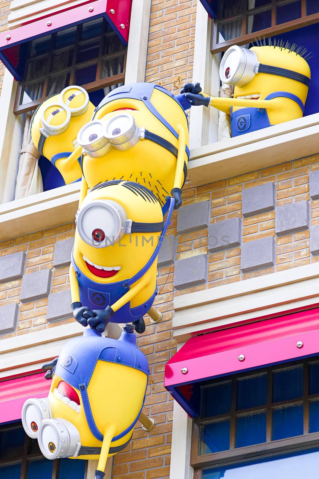 SAKA, JAPAN - June 24, 2017 : Statue of "HAPPY MINION", located in Universal Studios Japan, Osaka, Japan. Minions are famous character from Despicable Me animation.