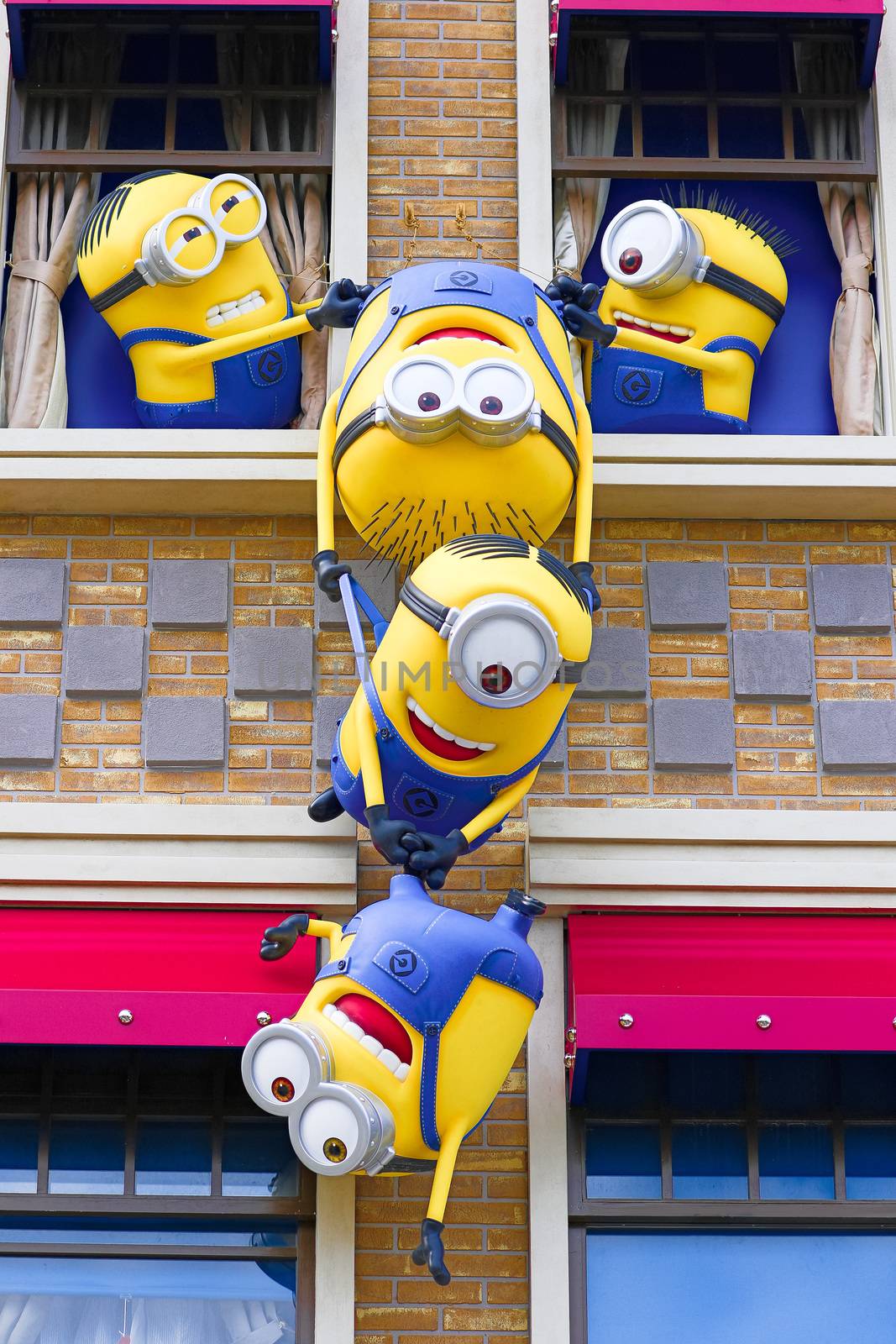 OSAKA, JAPAN - Nov 13, 2019 : Close up HAPPY MINION statue in Universal Studios Japan. Minions are famous character from Despicable Me animation. by USA-TARO