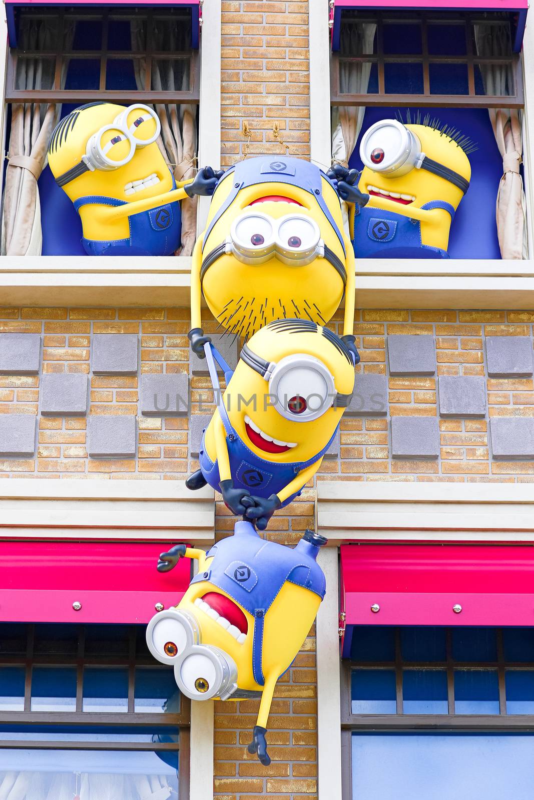 OSAKA, JAPAN - Nov 13, 2019 : Close up HAPPY MINION statue in Universal Studios Japan. Minions are famous character from Despicable Me animation.