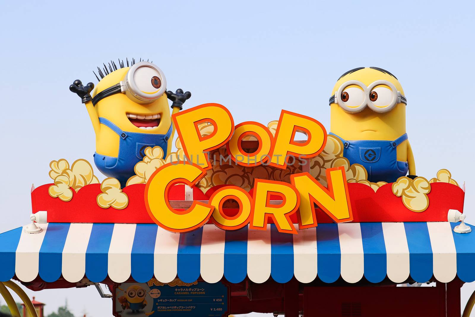 OSAKA, JAPAN - JAN 07, 2017 : Photo of "HAPPY MINION POP CORN SHOP", selling Minion Pop Corn, located in Universal Studios, Osaka, Japan. Minions are famous character from Despicable Me animation. by USA-TARO